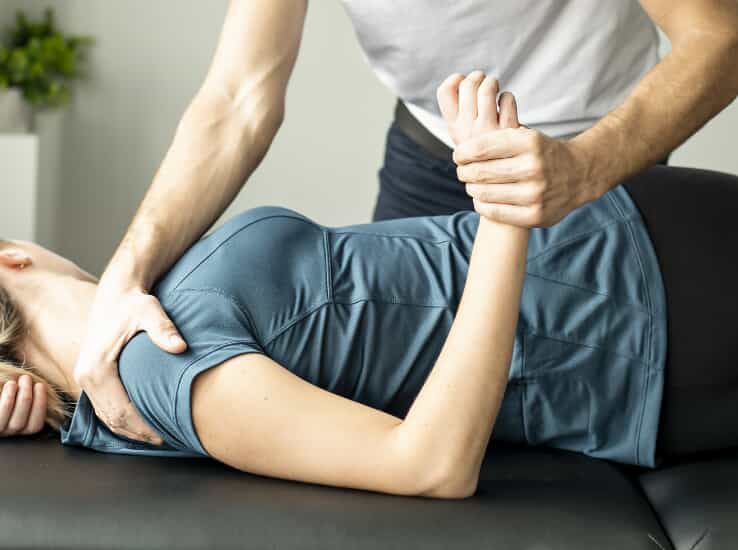 Woman being adjusted by a chiropractor